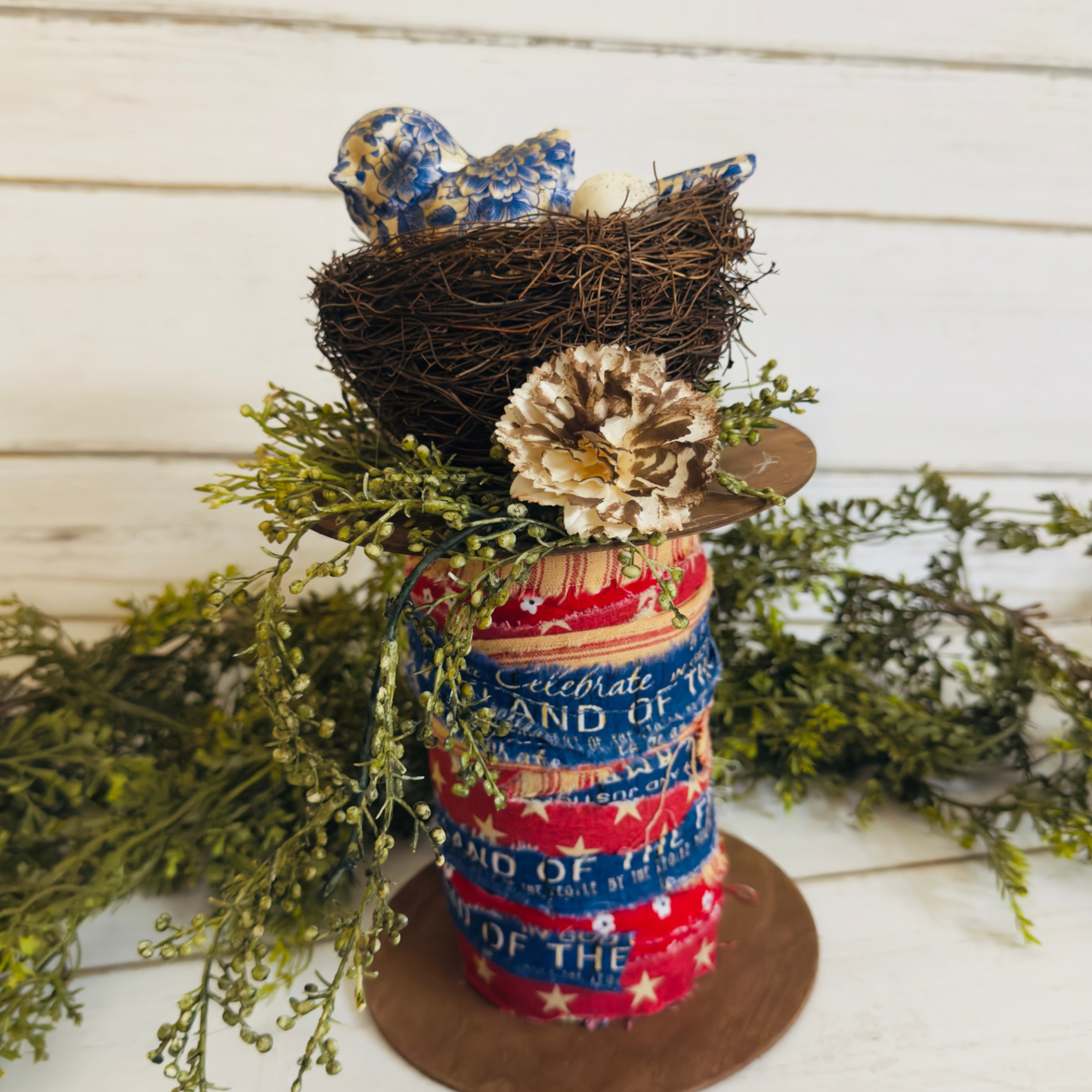 Patriotic spool with bird nest